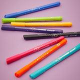 Set of colorful markers with 'Janod' branding on a purple background