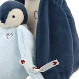 Plush penguin toy with a heart design on a white background