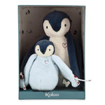 Two plush penguins in a box with 'Kaloo' branding on a white background