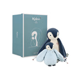 Two penguin plush toys with a blue box featuring the brand 'Kaloo' on a white background.