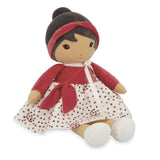 Toy doll with red outfit and white skirt on a white background