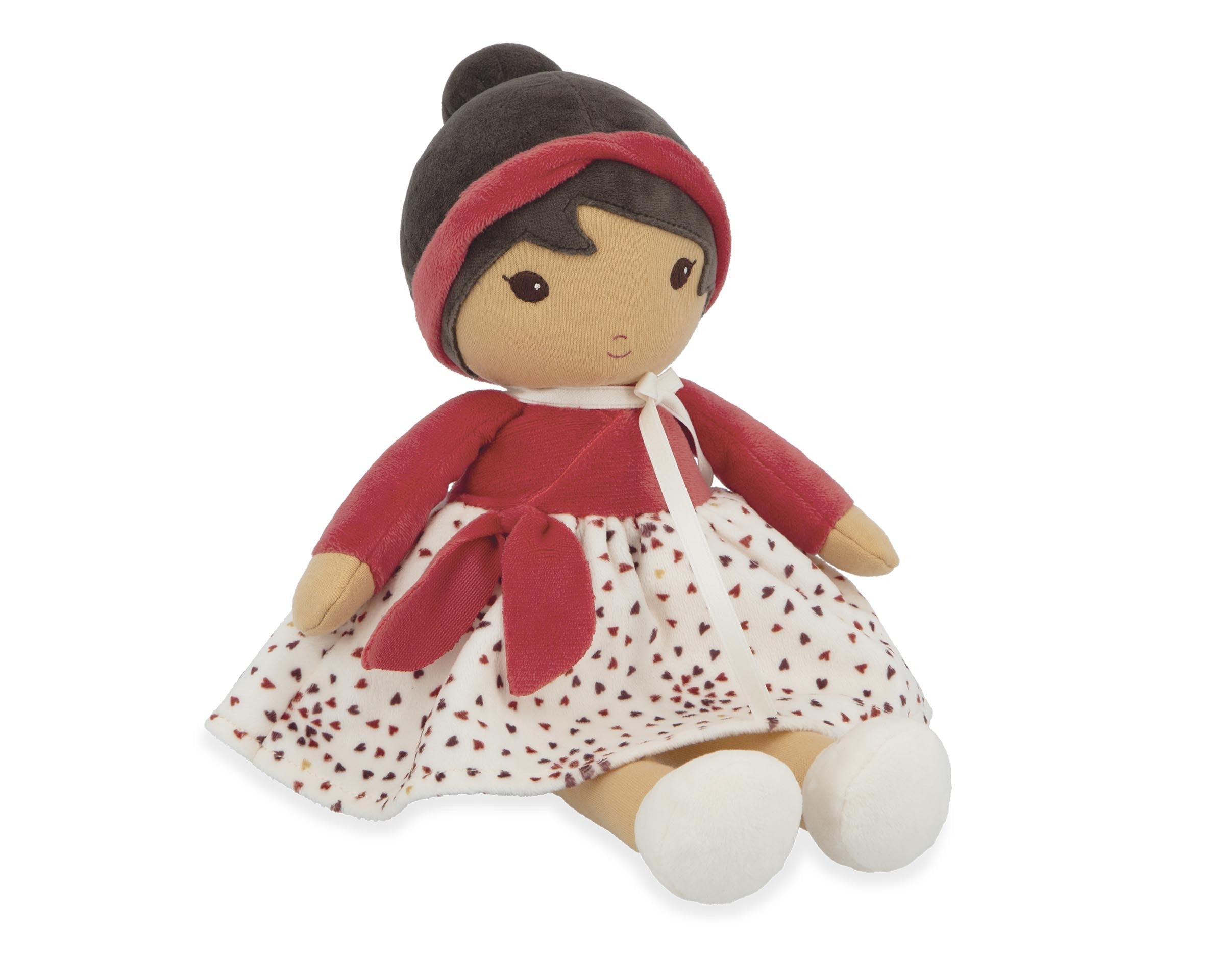 Toy doll with red outfit and white skirt on a white background