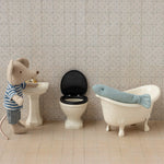 Stuffed mouse and fish in a bathroom scene with miniature sink, wc and bath