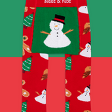 Red leggings with snowman pattern and 'Blade & Rose' branding on a green and red background