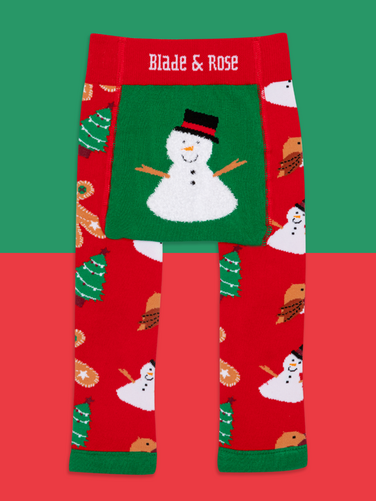 Red leggings with snowman pattern and 'Blade & Rose' branding on a green and red background